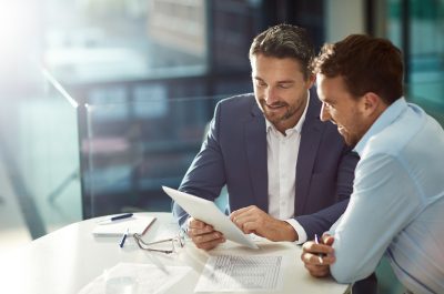 Sales representative in discussion with a colleague